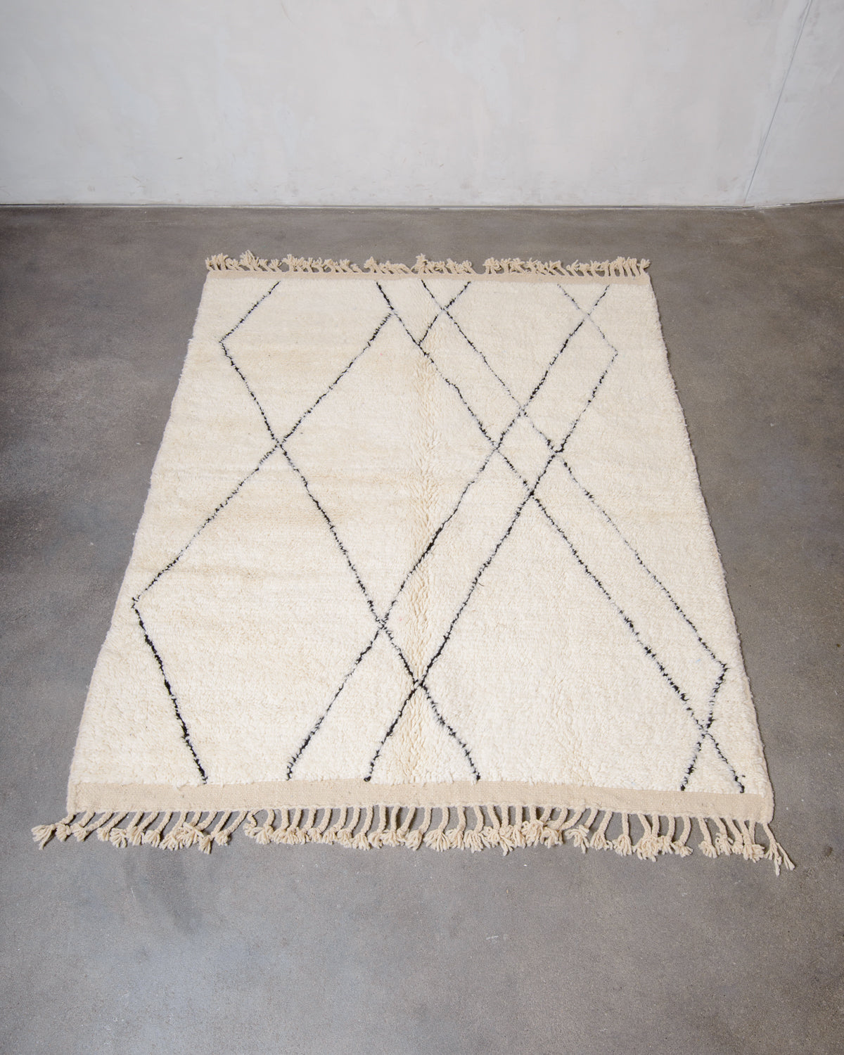 Modern, designer, handcrafted Berber rug from Morocco. Beniourain carpet with minimalist design, natural wool pile and a fluffy texture.